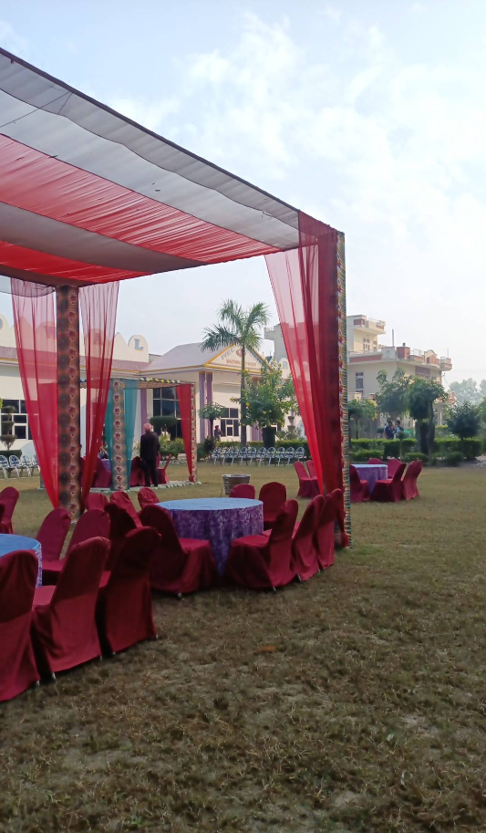 Garden setup with chairs, huts, and tables